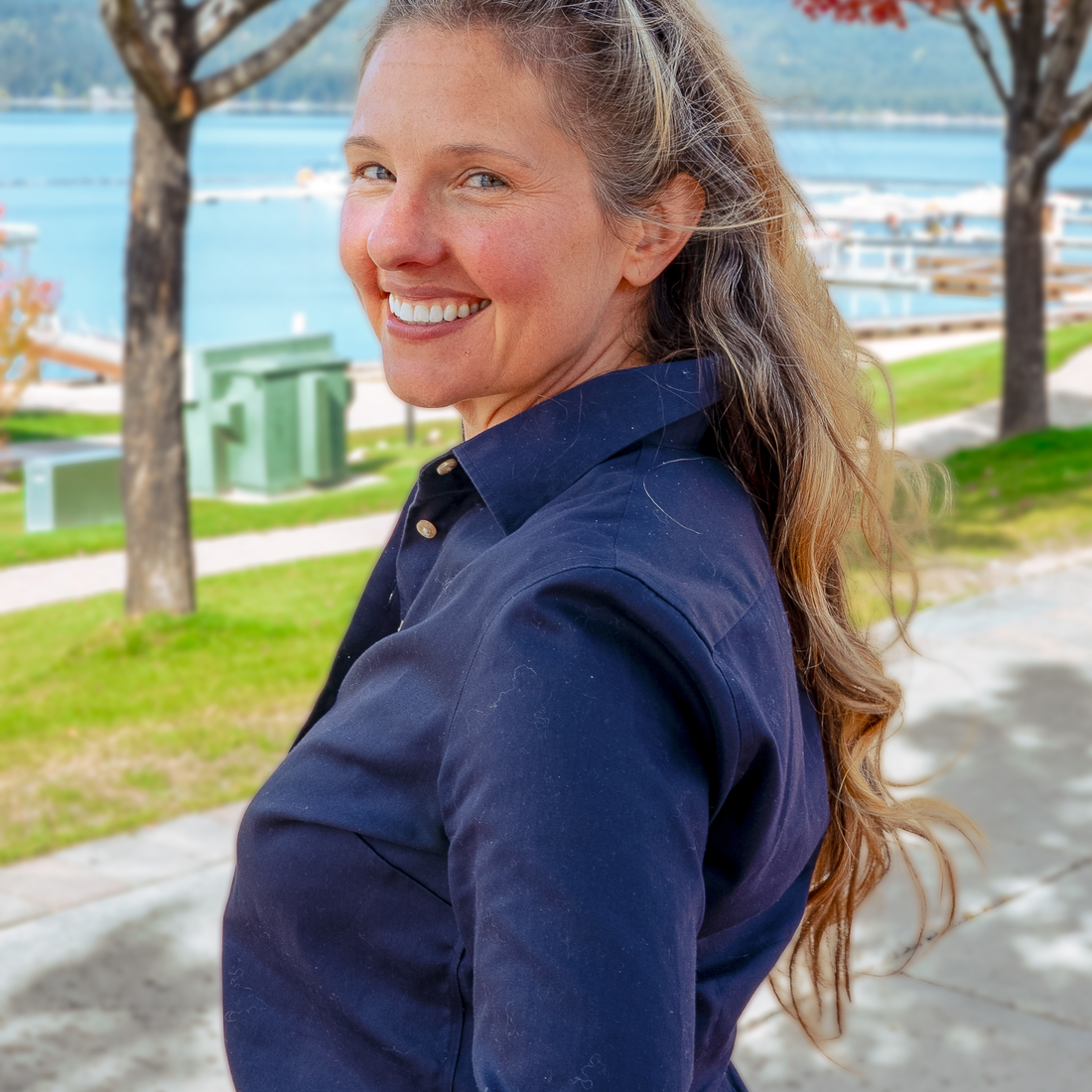 Jen Campbell standing in front of a lake