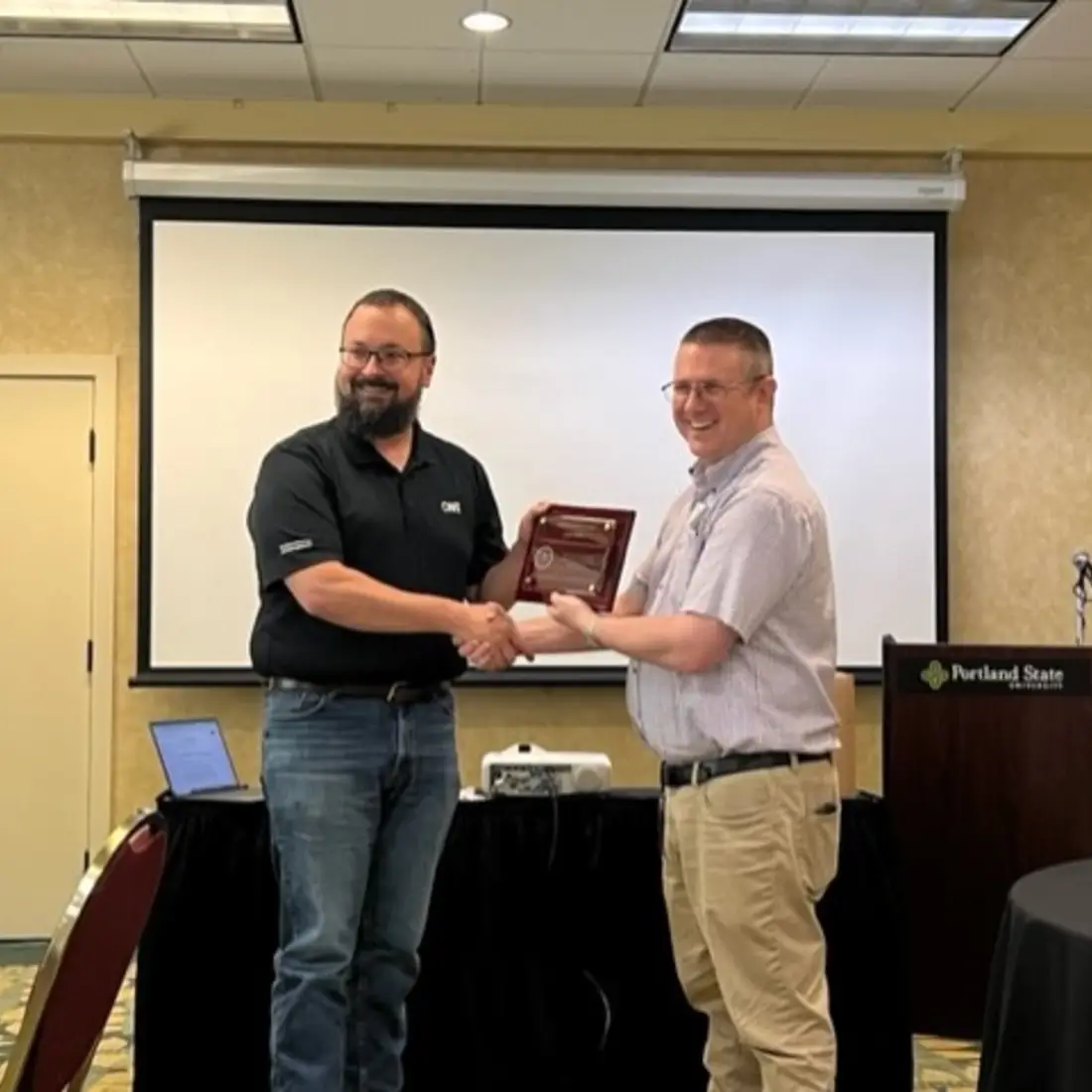 Josh Kifer recieving a plaque