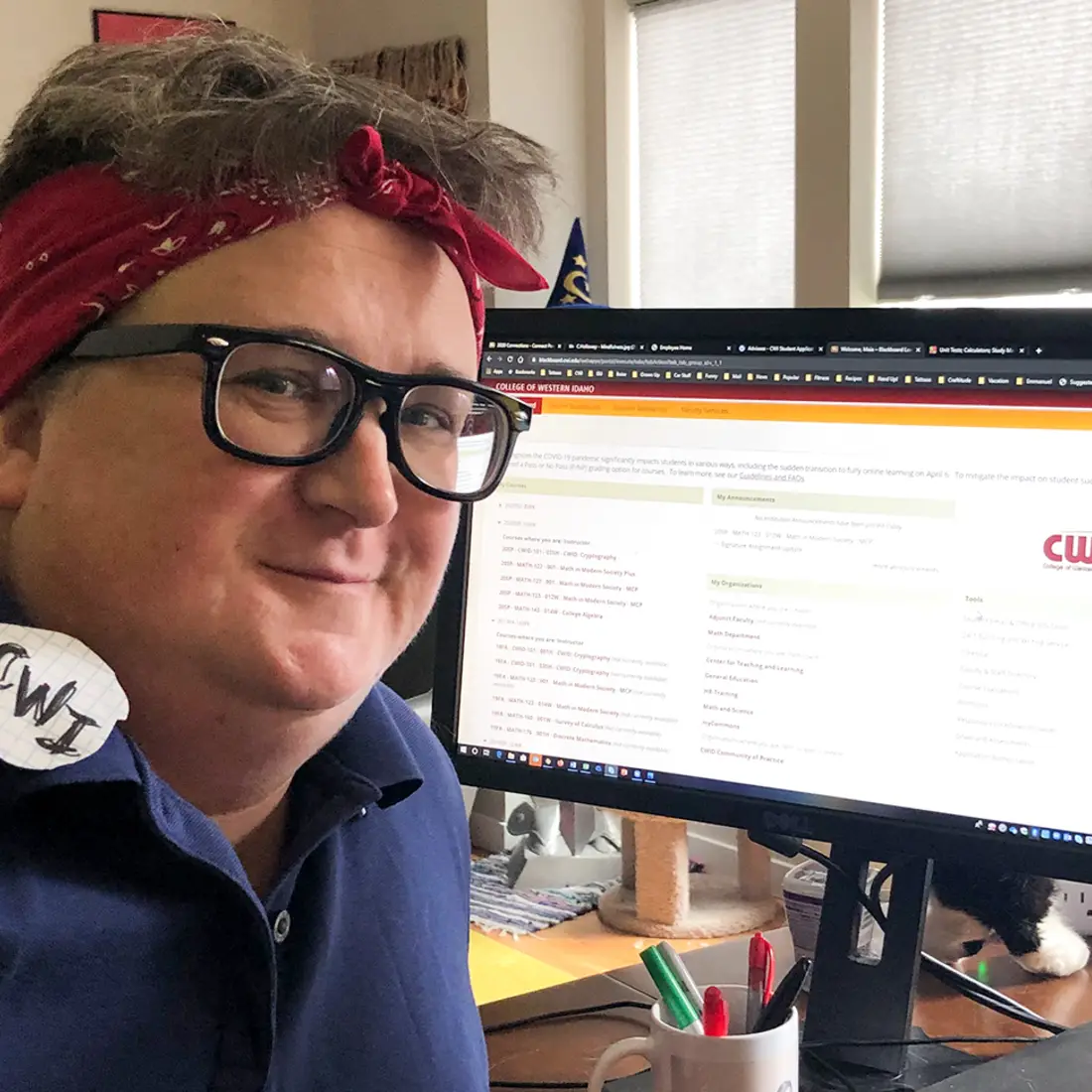 Maia Kelley, Assistant Professor of Math, working from home dressed as Rosie the Riveter