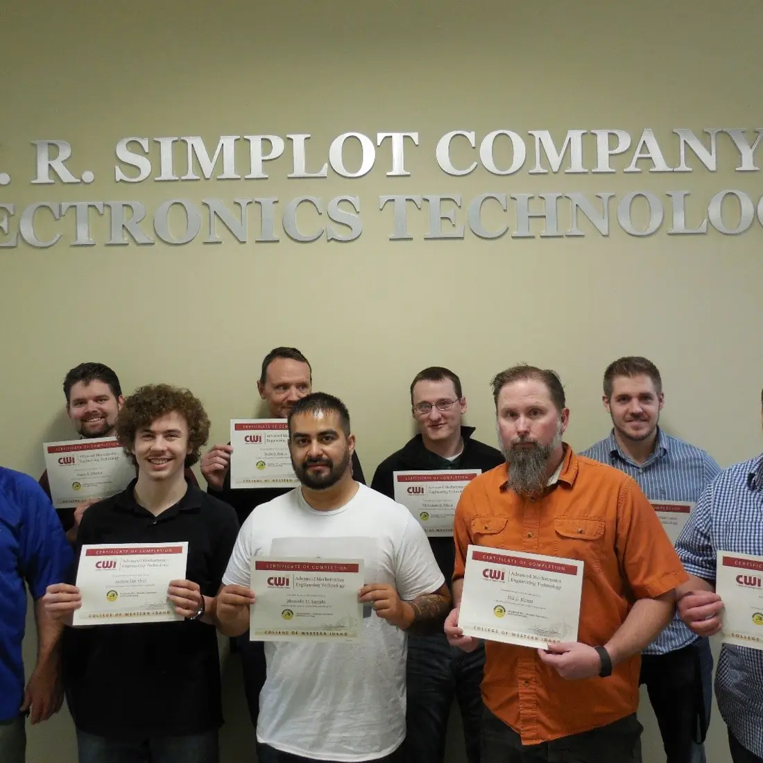 Group of students with FANUC Robotics as a Certified Education certificates.