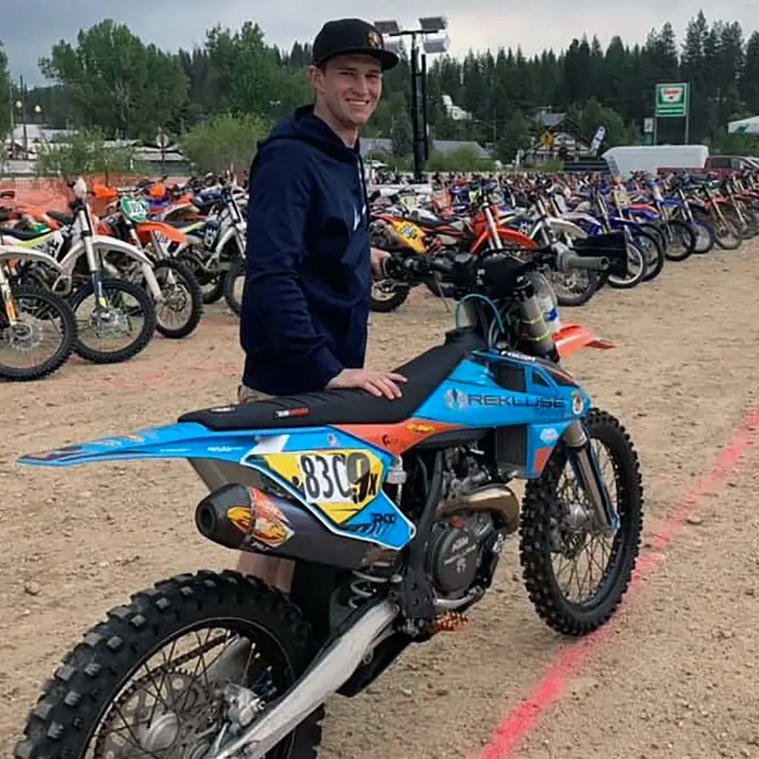 Nathaniel Dando poses with a motorcycle