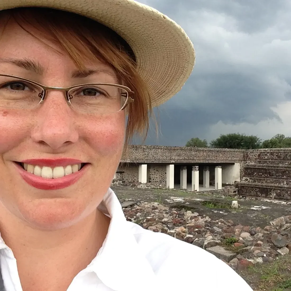 Nikki Gorrell outside with dark rain clouds