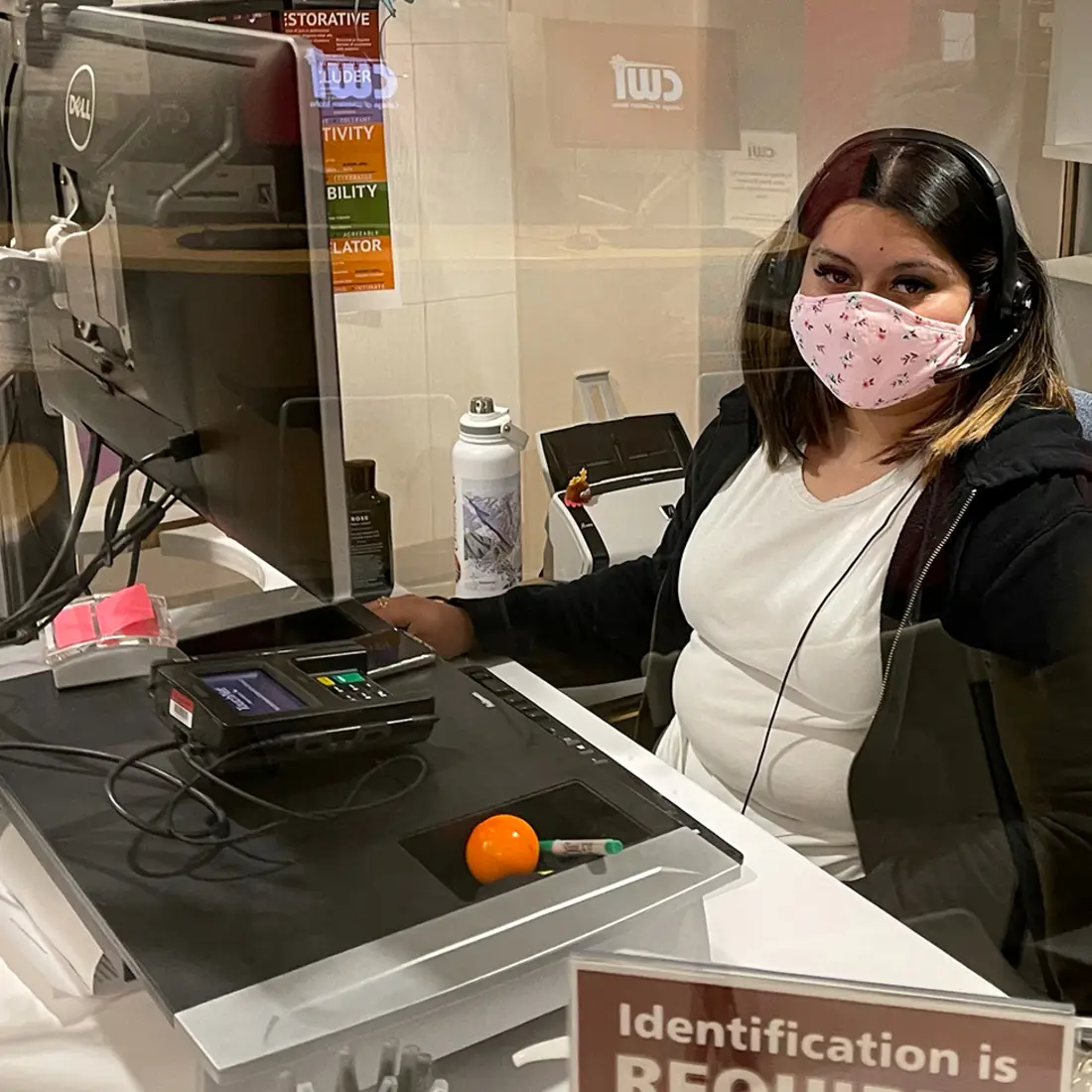 One Stop Student Services Representative at her desk on campus