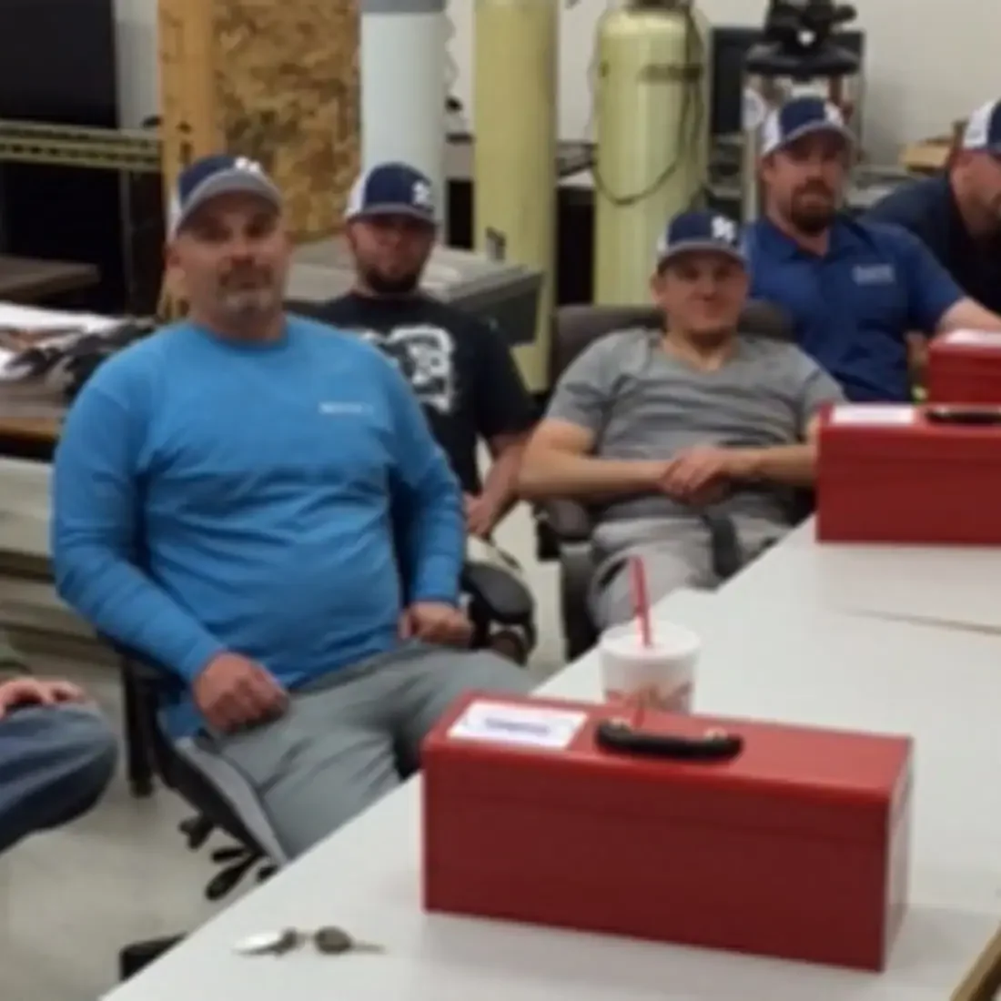 Plumbing Apprentices sitting at tables in a classroom