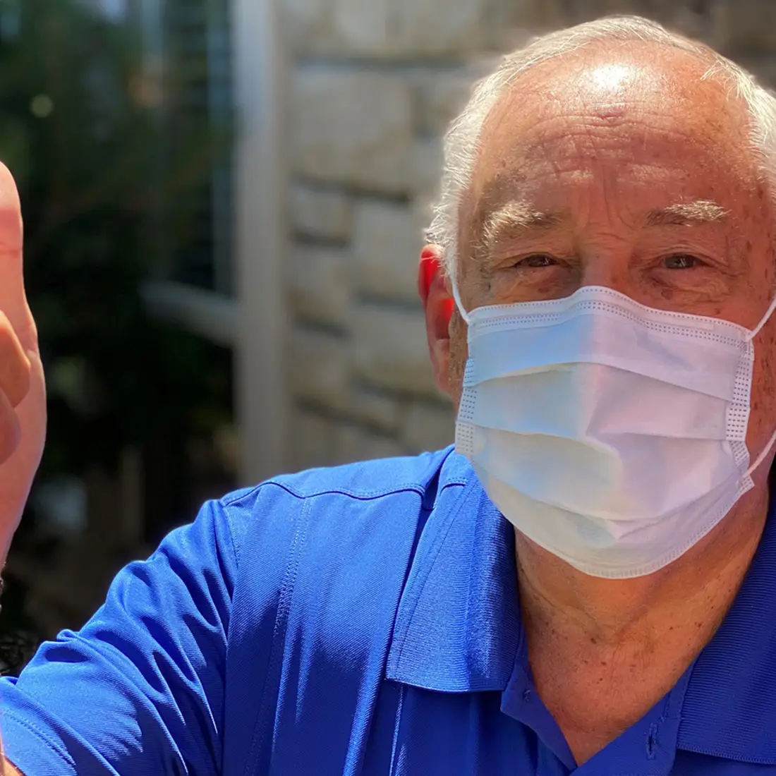 President Bert Glandon giving a thumbs up and wearing a mask