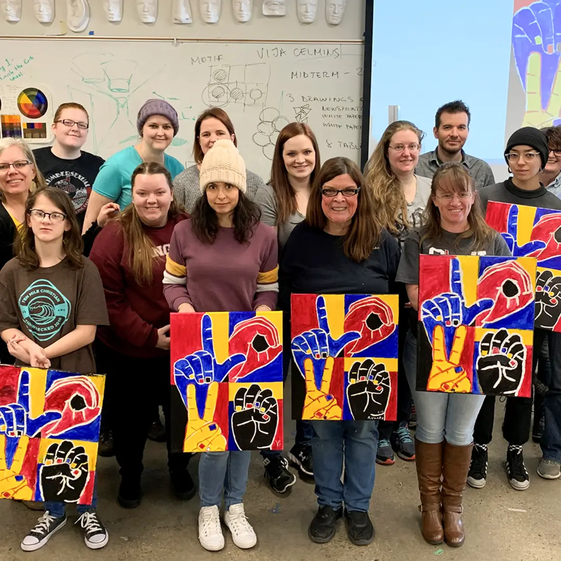 Students with Visiting Artist, Nancy Rourke, during a hands-on paint workshop Feb. 20. 