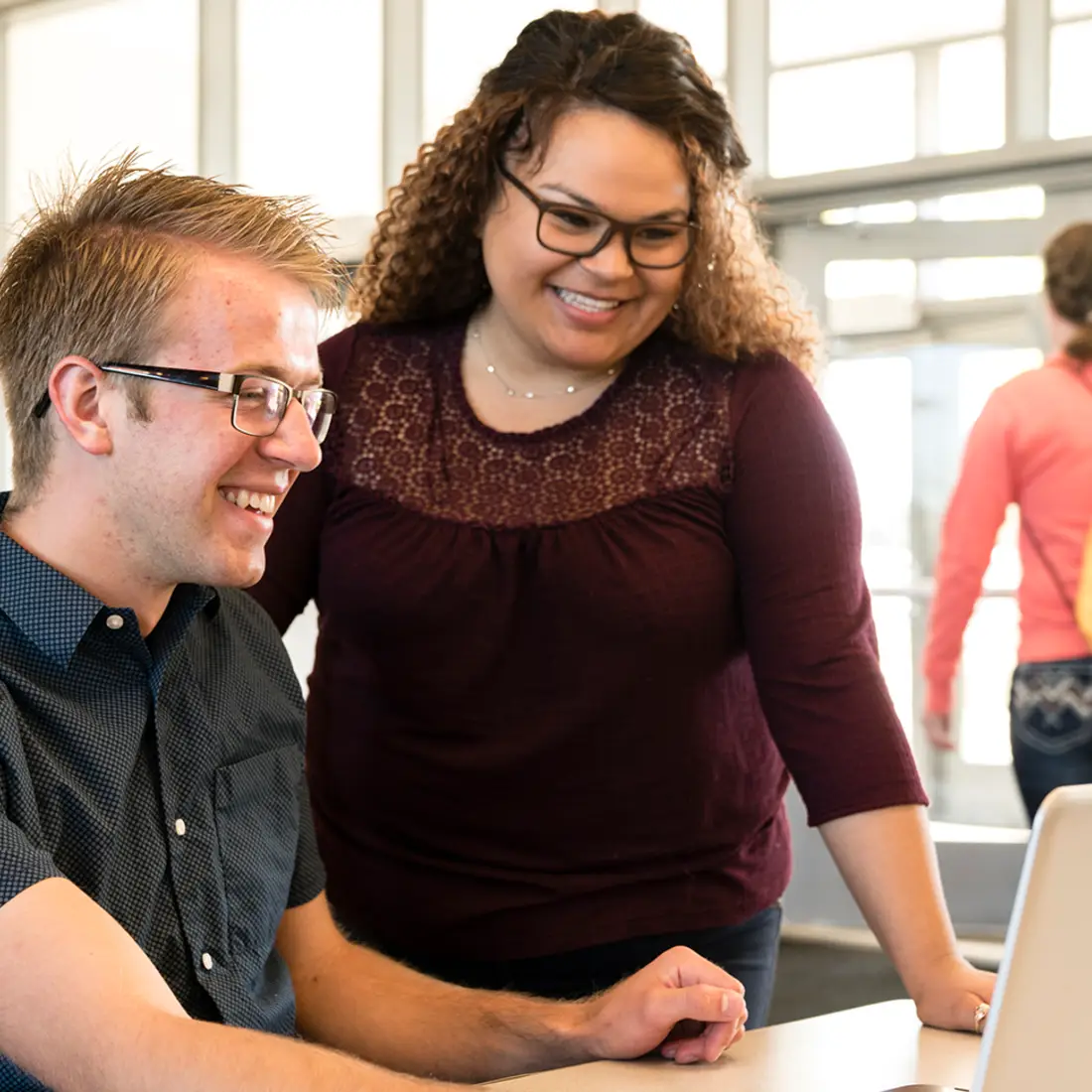 CWI students sitting at a laptop