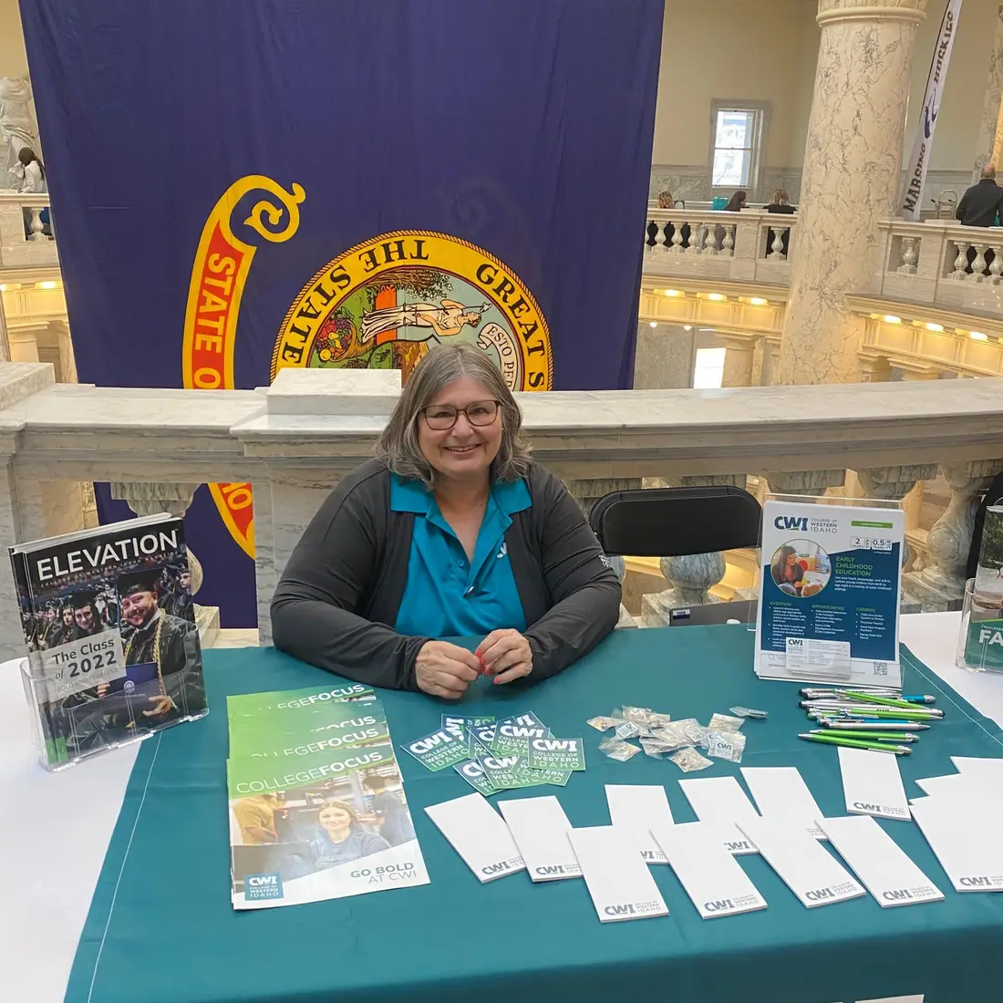 Sharol Viker at Idaho State Capitol at a CWI table