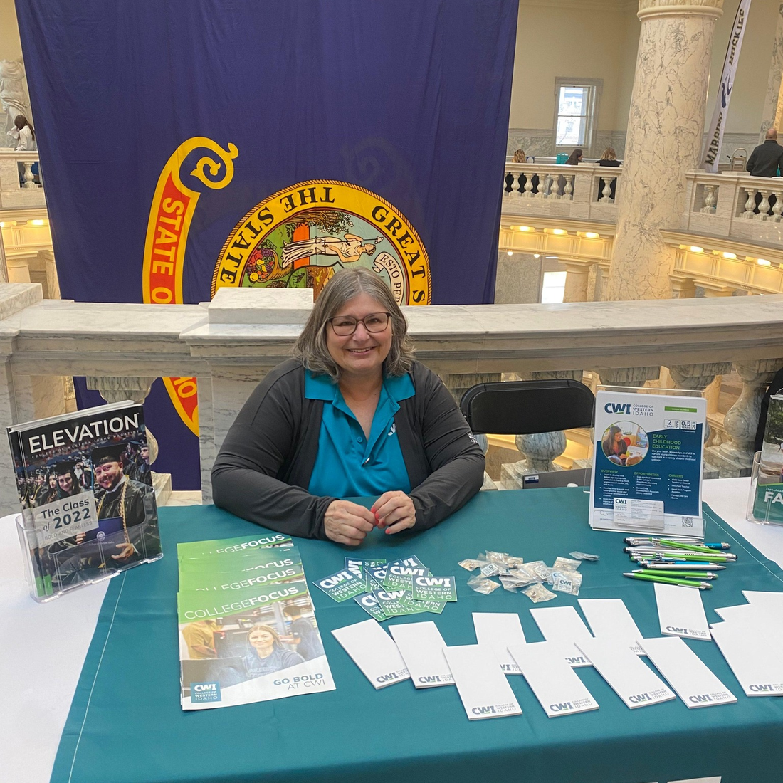 Sharol Viker at Idaho State Capitol at a CWI table