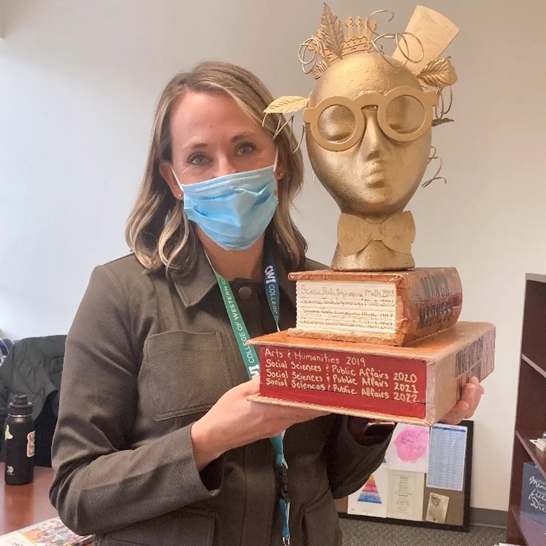 Courtney Santillan showing off Innovation in Action trophy