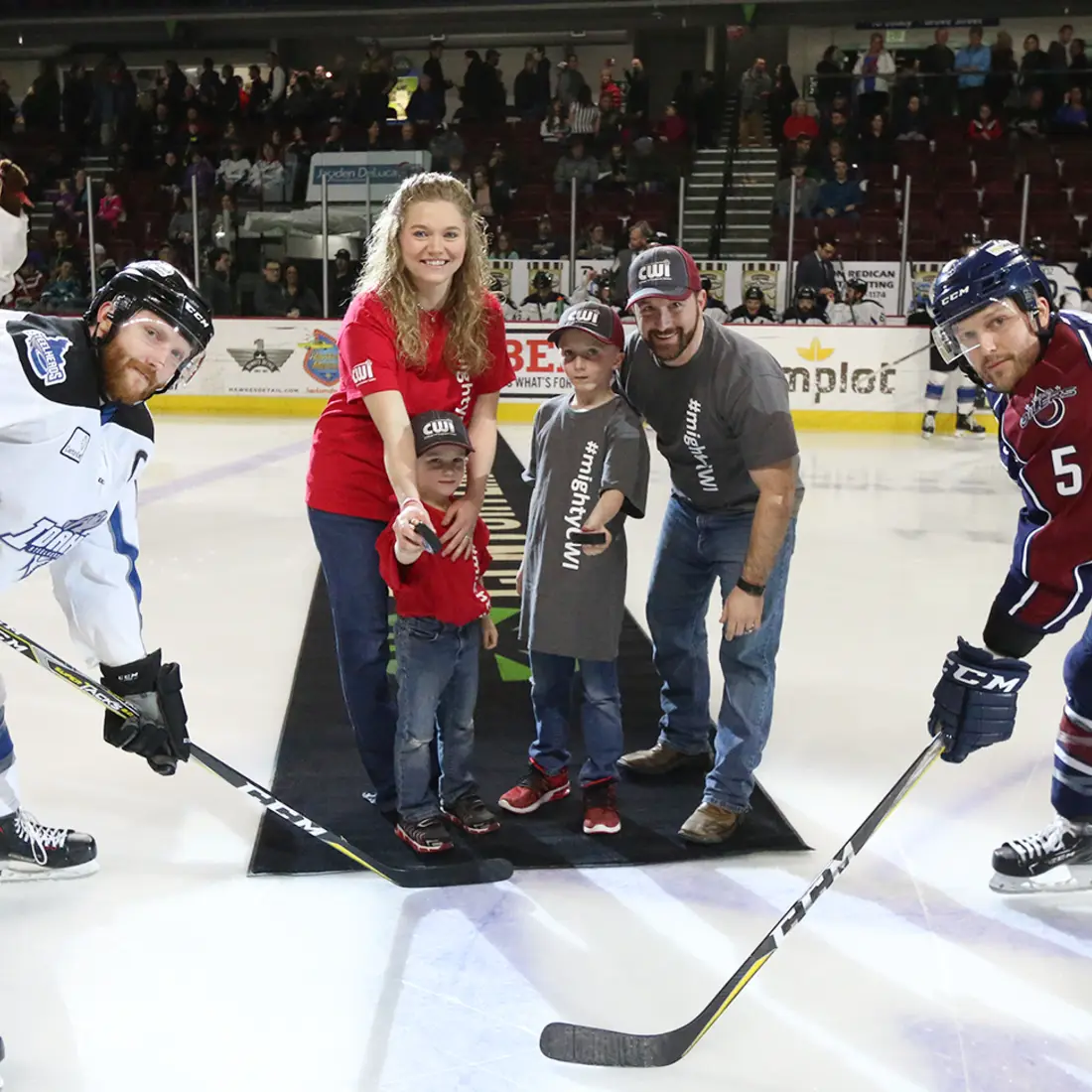 Puck drop by Tinker Family on the ice during CWI Night at the Idaho Steelheads