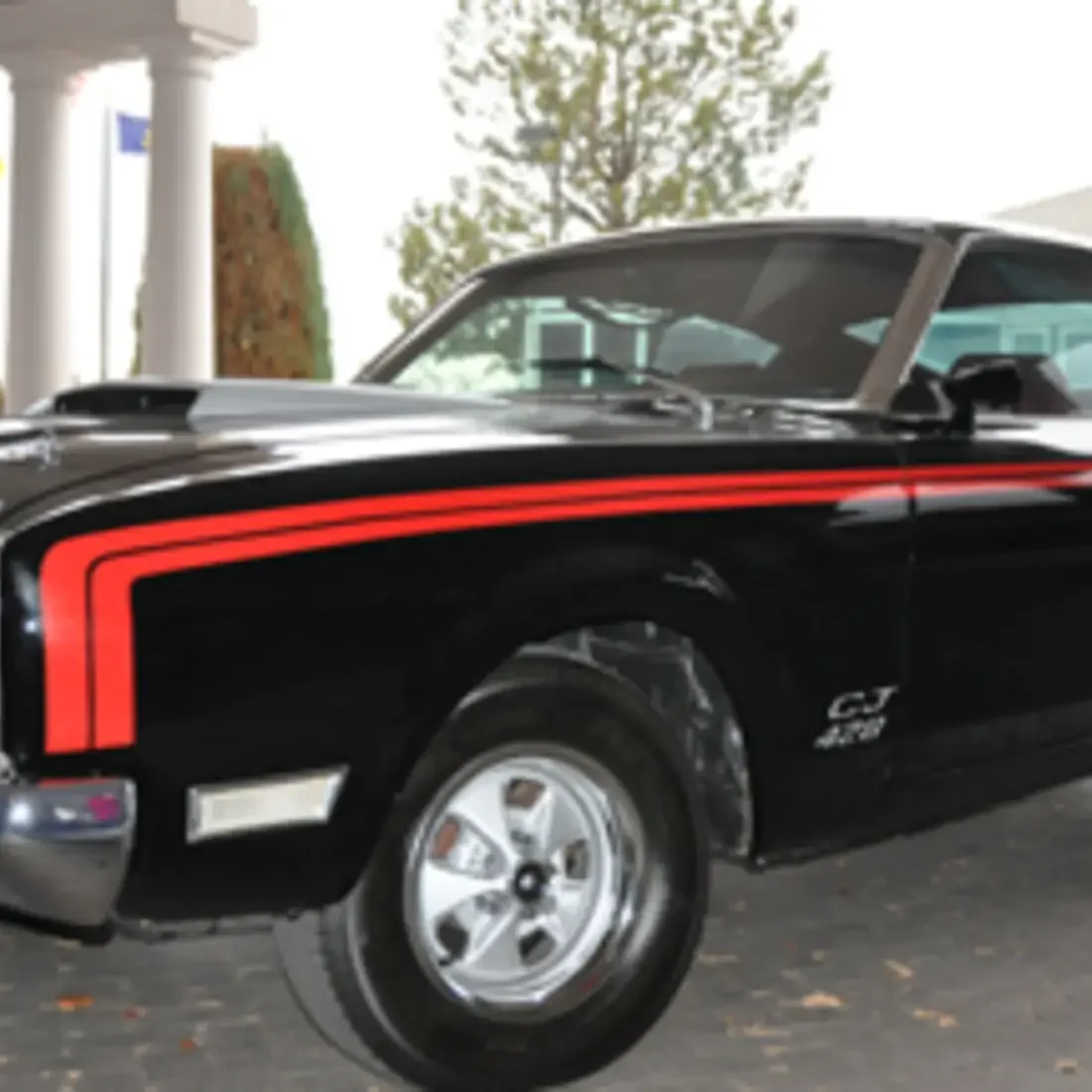 Students working on car