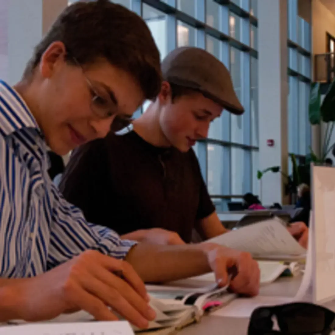 Students working at table in lobby