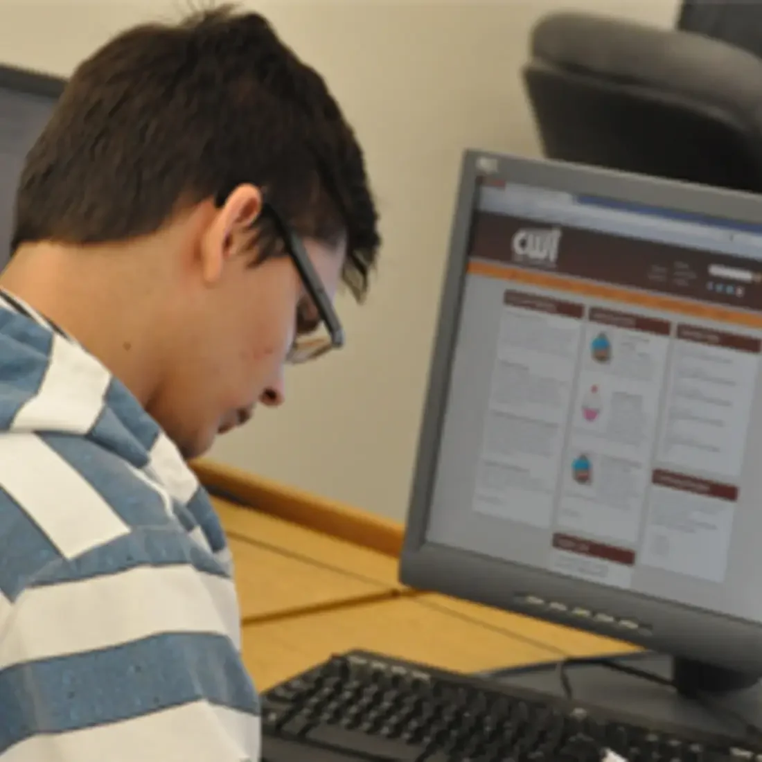 Student working on a desktop computer