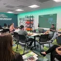 Group of people sitting and talking in the Entrepreneur Lab