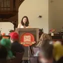 Person stands behind Storyfort podium