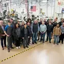 Group of people stand in Machine Tool lab