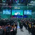 Confetti falls on the crowd at commencement