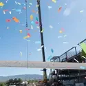 Beam raised, confetti surrounds 
