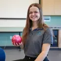 Gracie Young holding a weighted ball