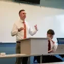 Student speaks in front of audience