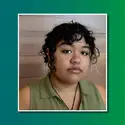 Picture of LeAndra Onya in front of green background