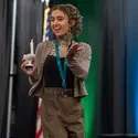 Graduate with candle walking across stage