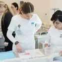 Two nursing students looking at material