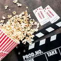 Popcorn bucket, tickets, and clapperboard
