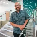 Alex Nava on a staircase
