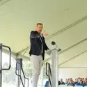 President Gordon Jones stands behind podium