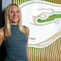 Brooke Garman standing near Otter wall