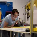 Student using a piece of equipment in lab classroom