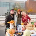 Three people dressed up in costumes
