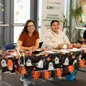 People at a table, smiling