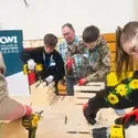 Students learn about trade skills from an instructor.