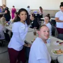 Students attending a barbecue hosted by Saint Alphonsus Aug. 27, 2019