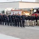 Fire and Police first responders bow their heads in remembrance of 9/11.