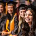 Students in caps and gowns at graduation