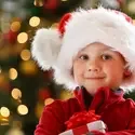 Child wearing a Santa ht