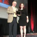 Rhonna Krouse accepting award at during the League for Innovation’s 2019 Conference in New York City.