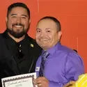 Luis Caloca with recognition certificate