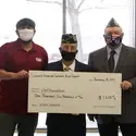 Ivan Castillo accepting a donation to the CWI Foundation from the Disabled American Veterans Chapter 2 Boise