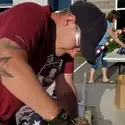CWI student Dallas Hulsey helps assemble flags for the Eagle Field of Honor.