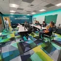 Students listen to a presentation in an Entrepreneur Lab.