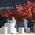 Student studying outside the Nampa Campus Academic Building in the fall