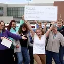 Wishing Well Fund recipients group shot with giant check