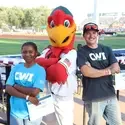 SCORE Big Scholarship recipients, Yvone Kaulta and Tucker Marcus with Humphrey the Hawk
