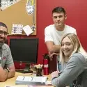 One Stop Representative talking to two students