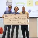 Lower Gear Cycles team accepting prize money on state at Idaho Entrepreneur Challenge